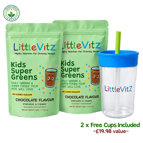 Two LittleVitz Kids Super Greens chocolate flavour pouches shown with two free cups included: one clear cup with a blue lid and green straw, and one blue tumbler with a clear lid. The background is white with a small green organic certification logo in the top left and text reading '2 x Free Cups Included ~£19.