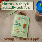 A packet of LittleVitz Kids Super Greens chocolate flavour powder sits on a countertop with a spoonful of powder, a blue-lidded drink cup, and a text banner reading 'Nutrition they'll actually ask for.'.